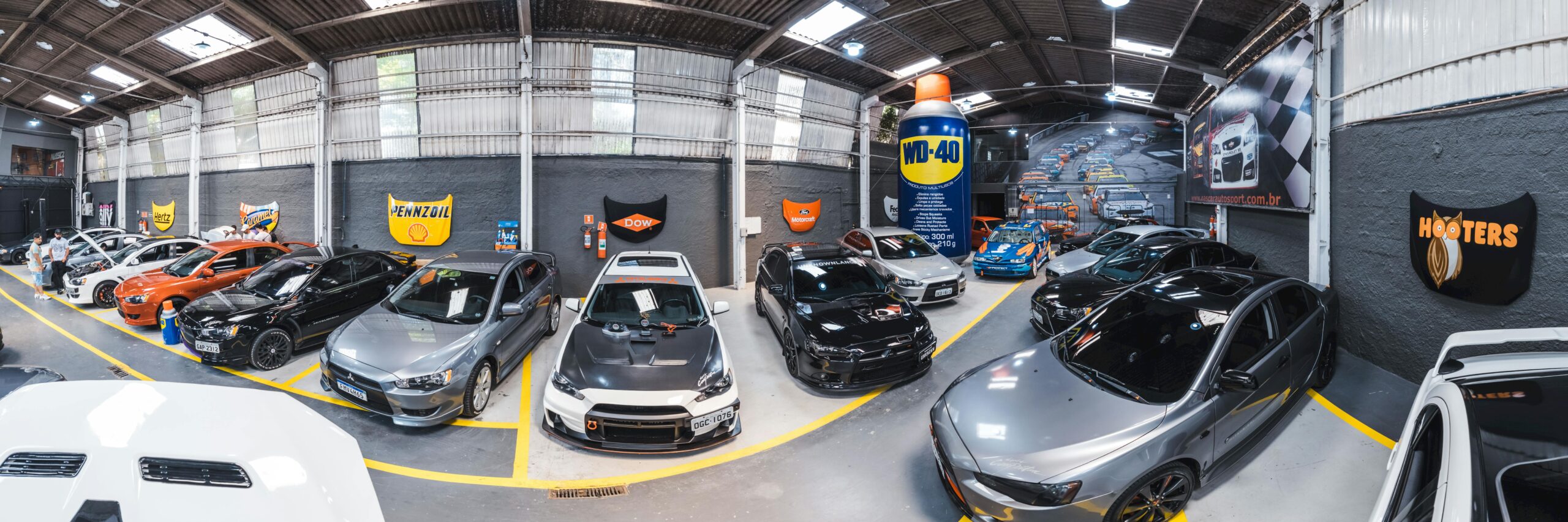 Panoramic view of Vila Nair garage filled with sports cars in São Paulo, Brazil.